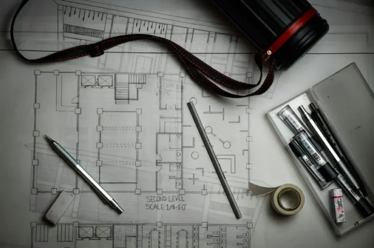Architectural floor plan with drafting pens for plan approval