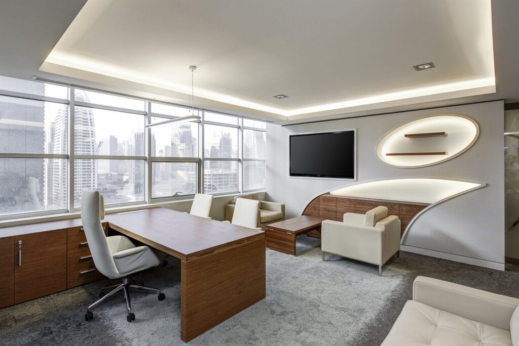 Executive office with a curved feature wall and lounge area