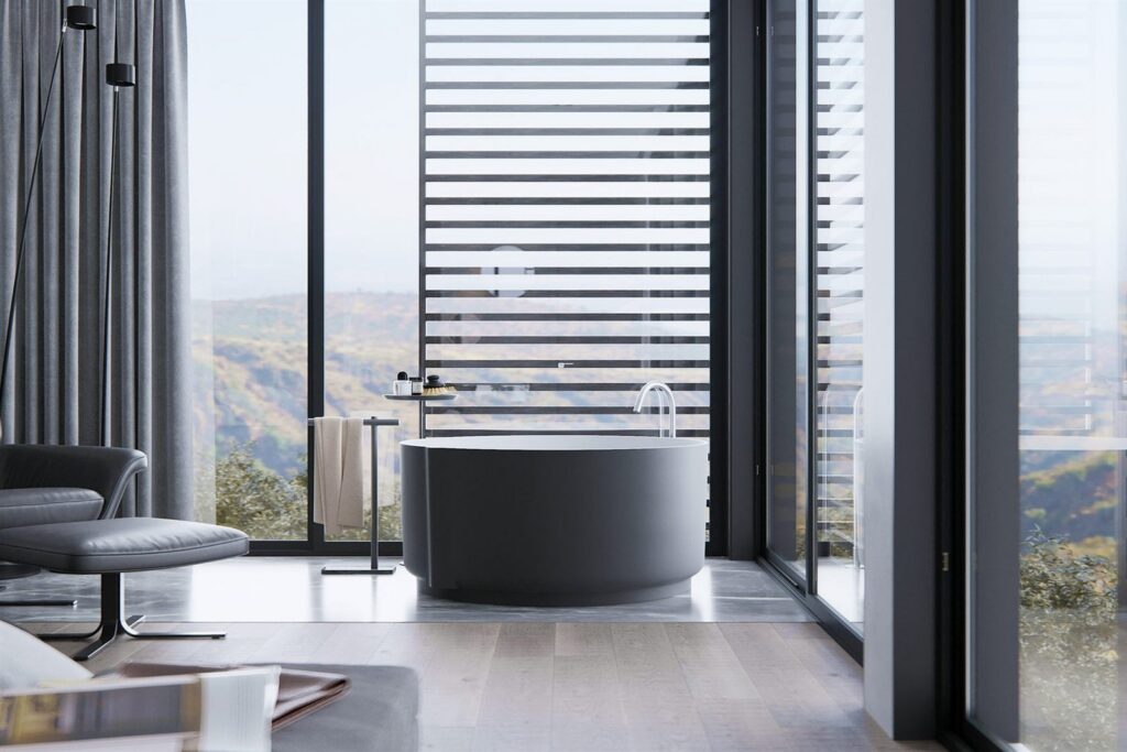 Modern bathroom with a freestanding bath and floor-to-ceiling windows