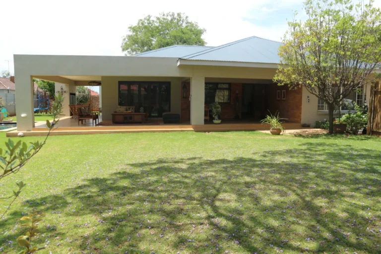 Covered patio wrapping around a renovated heritage house in Greenside